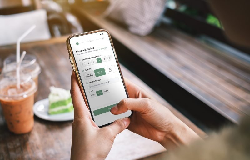 Woman hand holding the mobile phone screen mockup template